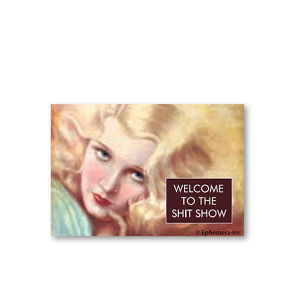 Rectangular magnet with all-over illustration of a woman with flowing blonde hair says, "Welcome to the shit show" in a box at bottom right
