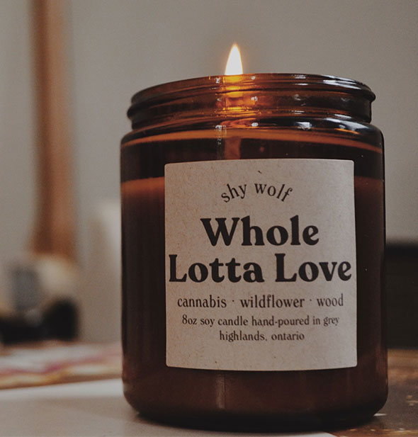 Lit Whole Lotta Love amber glass jar candle