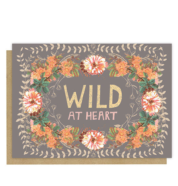 Warm gray greeting card with intricate floral design says, "Wild at heart" in the center in gold and pink lettering