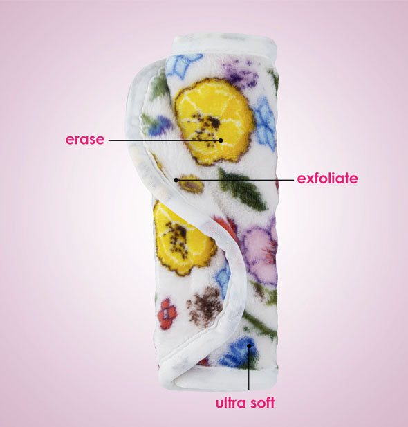 Rolled up Wildflowers print MakeUp Eraser cloth is labeled, Erase, Exfoliate, Ultra Soft