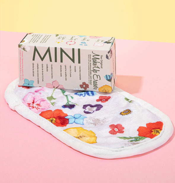 The Original MakeUp Eraser Mini Wildflowers edition lays unfolded with box resting on top