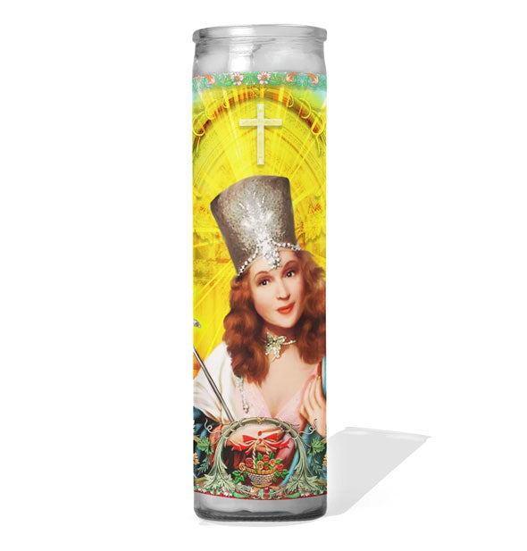 Glass cathedral style prayer candle featuring an image of Glinda the Good Witch from The Wizard of Oz film portrayed as a saint