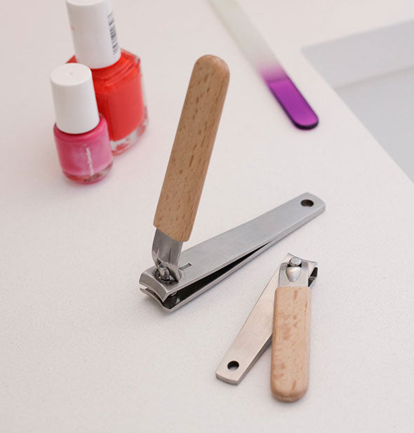 Small and large beechwood and stainless steel nail clippers with other nail supplies