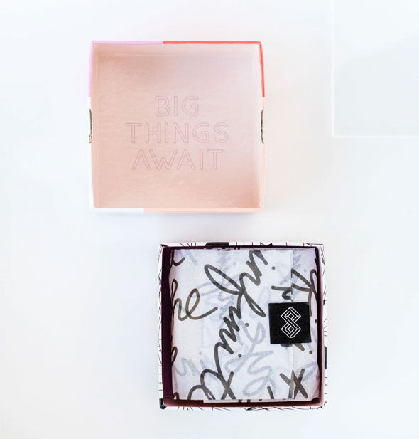 Bar soap box with lid removed to reveal inside stamped with the words, "Big things await"