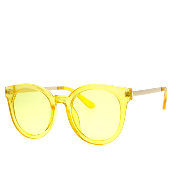 Pair of rounded sunglasses with clear yellow frame and yellow lens