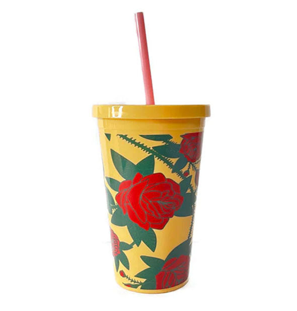 Yellow drink tumbler with yellow lid and pink straw features a wrap-around red and green thorny rose design