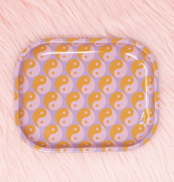 Rectangular tray with rounded corners and pink, orange, and purple yin yang print