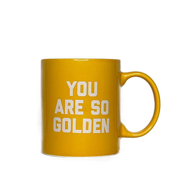 Yellow coffee mug says, "You are so golden" in white lettering